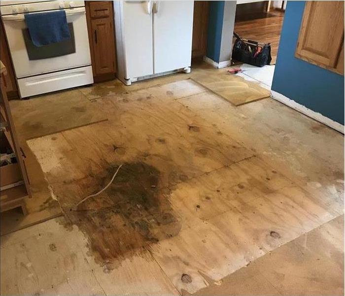 kitchen subfloor with water damage and rot 