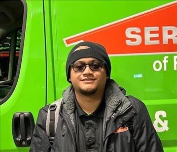 man standing in front of servpro van